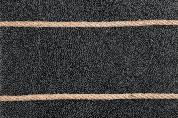 The two ropes lie on natural leather — Stock Photo, Image