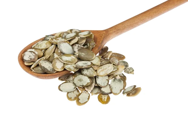 Wooden spoon with pumpkin seeds — Stock Photo, Image