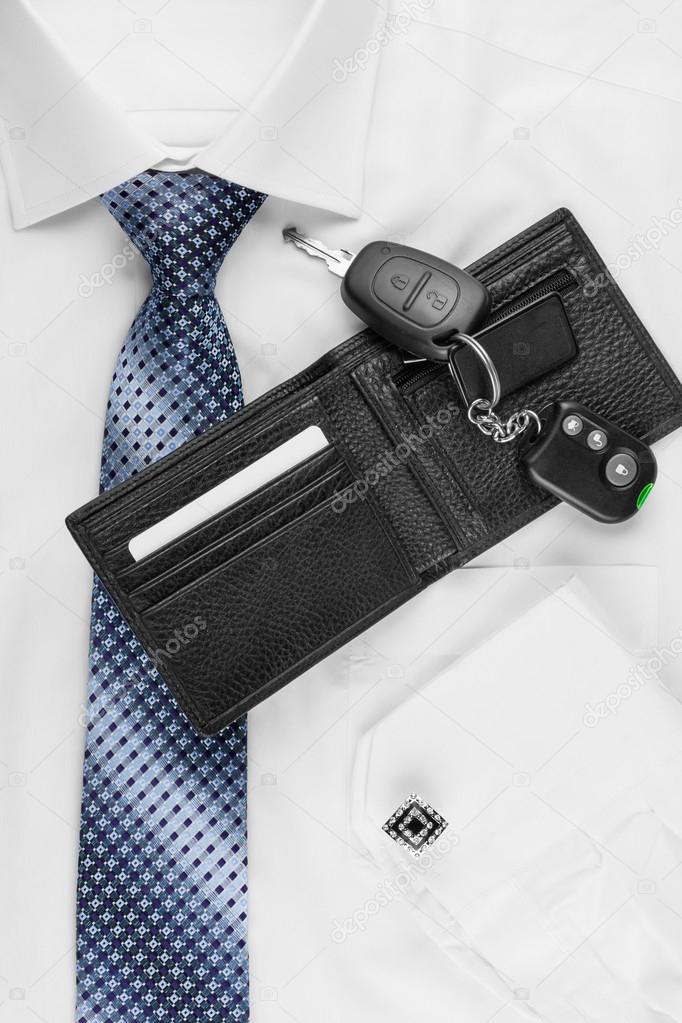 Wallet, keys  lying on the shirt  and tie