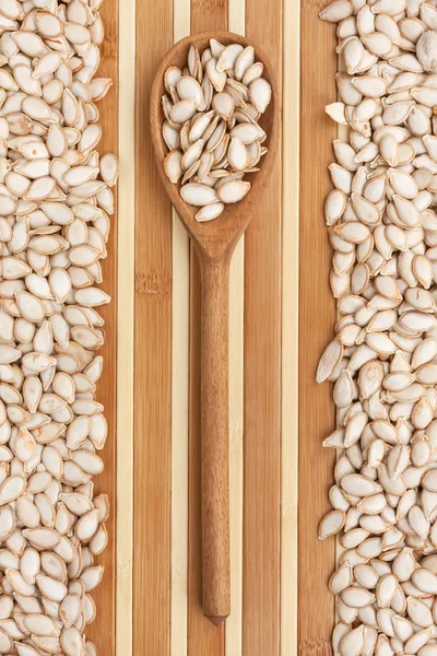 Wooden spoon with  pumpkin  seed — Stock Photo, Image