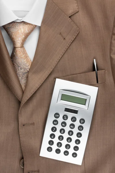 Calculator lies on the suit — Stock Photo, Image