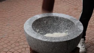 Japanese New Year's Food Tradition, Beating Rice Cakes in a Big Stone Bowl