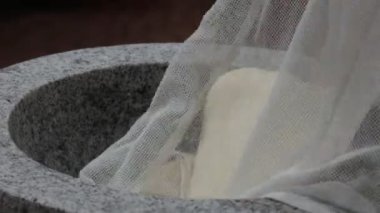 Japanese New Year's Food Tradition, Beating Rice Cakes in a Big Stone Bowl