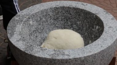 Japanese New Year's Food Tradition, Beating Rice Cakes in a Big Stone Bowl