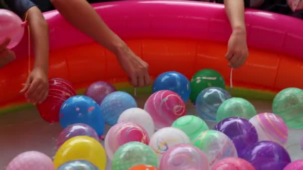 Hands Children Playing Balloons Rubber Pool Water — Stockvideo