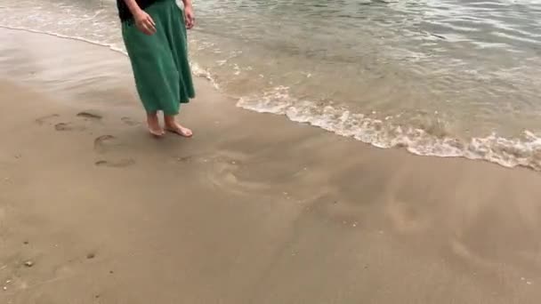 Woman Walks Slowly Beach Waves Lapping Her Feet — Wideo stockowe