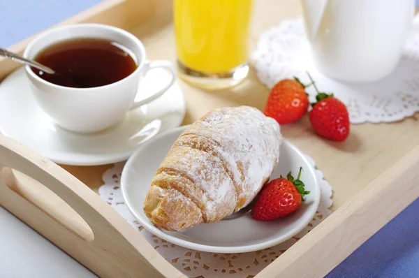 Breakfast with tea and croissants — Stock Photo, Image