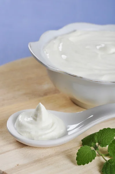 Sour cream in spoon — Stock Photo, Image