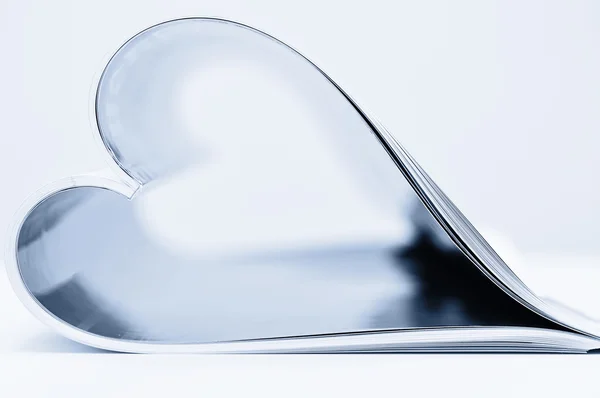 Magazine folded into a heart shape — Stock Photo, Image