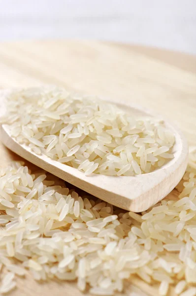 Rice in wooden spoon — Stock Photo, Image