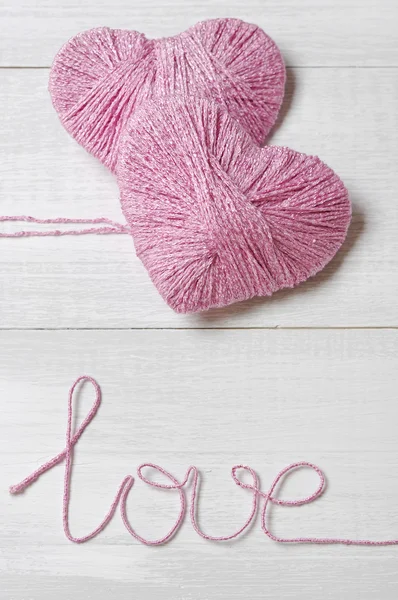 Two pink clews in shape of heart — Stock Photo, Image