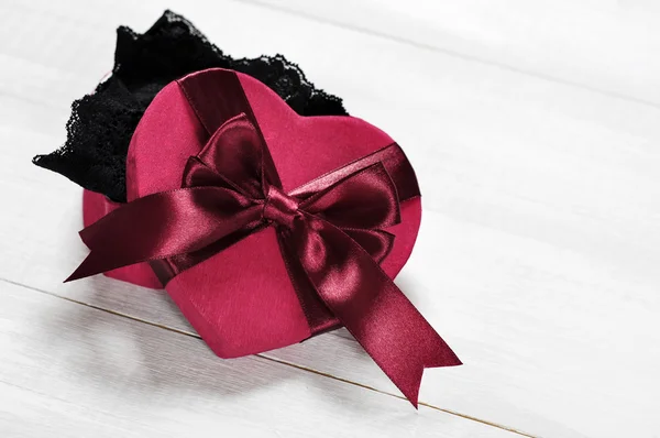 Black lingerie in a red box — Stock Photo, Image