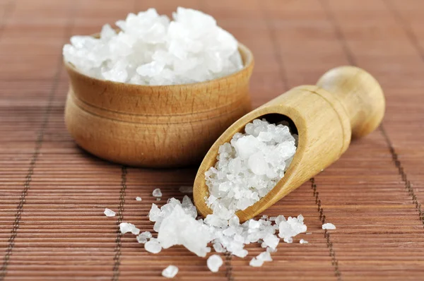 Sea salt in wooden scoop — Stock Photo, Image
