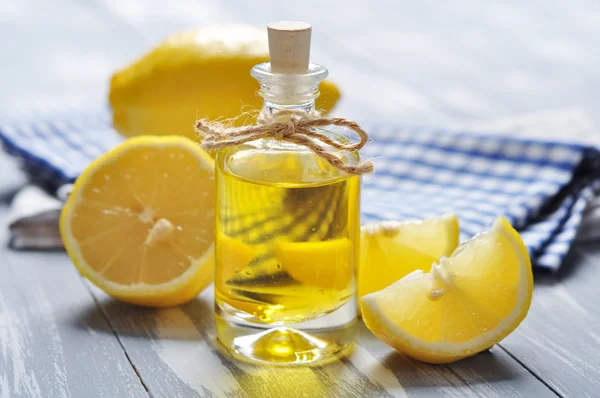 Lemon oil in a glass bottle — Stock Photo, Image