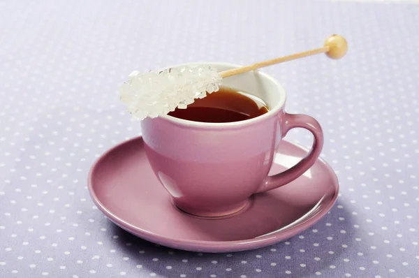 Tea in cup with candy sugar — Stock Photo, Image