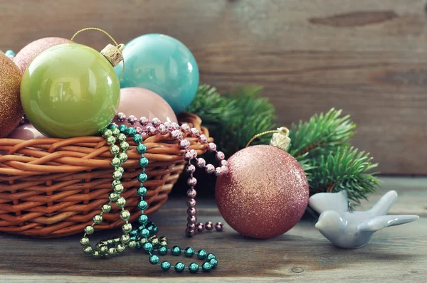 Christmas decorations in wicker basket — Stock Photo, Image