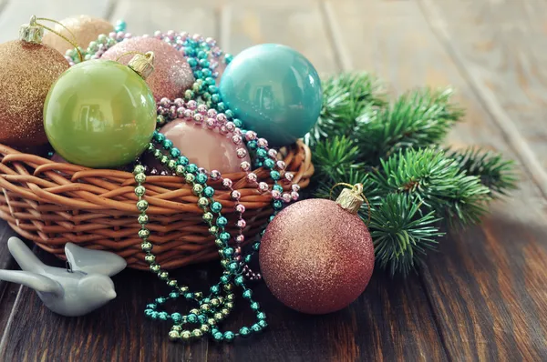 Christmas decorations in wicker basket — Stock Photo, Image