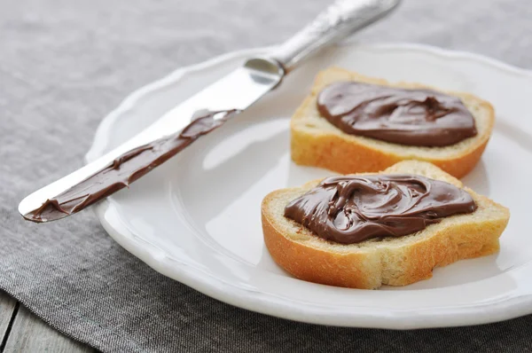 Bread with hazelnut cream — Stock Photo, Image