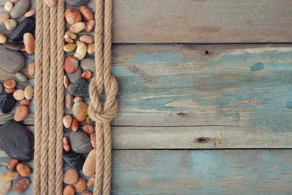 Sea stones with rope — Stock Photo, Image