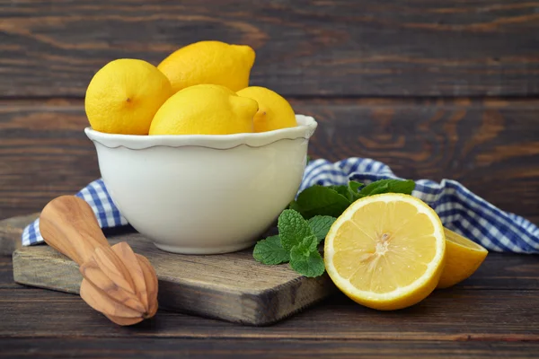 Lemons in a white bowl — Stock Photo, Image