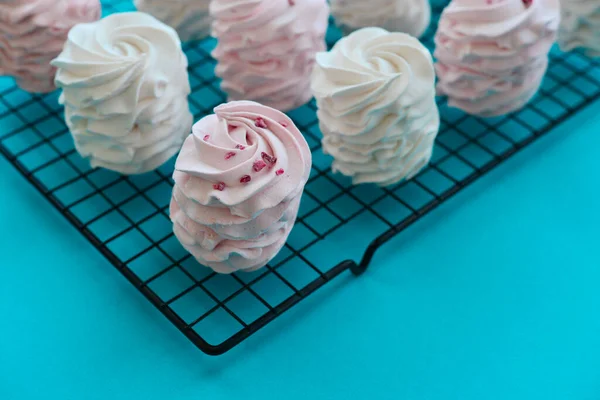 Homemade White Pink Zephyr Confectionery Metal Grid Blue Background — 스톡 사진