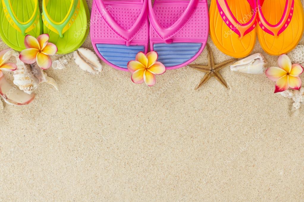 Colorful Flip Flops in the sand with shells and frangipani flowe ⬇ ...