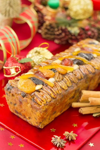 Christmas Fruit-cake with festive decoration — Stock Photo, Image