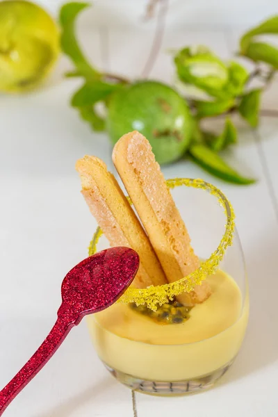 Glasses of passion fruit dessert with red spoon — Stock Photo, Image