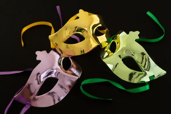 Three carnival masks on dark background — Stock Photo, Image