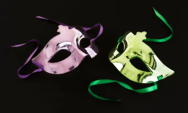 Purple and green carnival mask on dark background — Stock Photo, Image