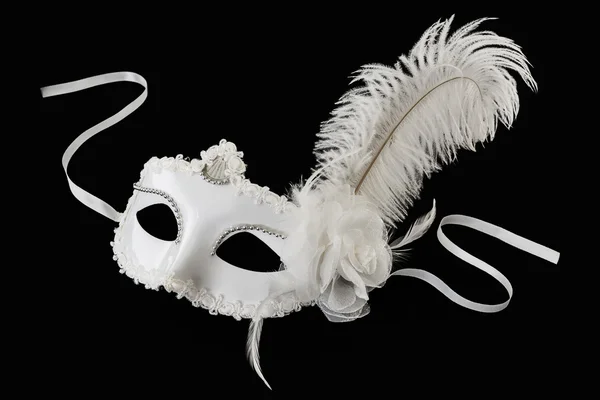 Single White carnival mask with feather on black background — Stock Photo, Image