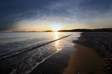 Karaot sahilinde gün batımından. Yaniklar köyü, Fethiye.