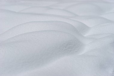 Snowdrifts in winter. Clean snow background