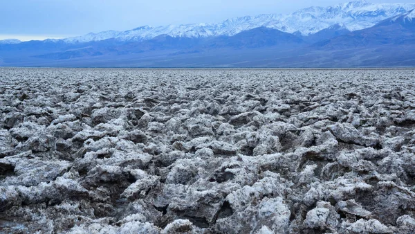 Death Valley National Park, Salt with clay, California. Smooth salt valley with cracked and swollen salt, dead salt landscape