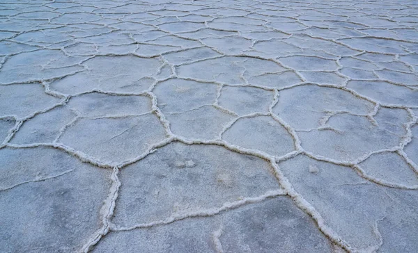 Death Valley National Park, Salt with clay, California. Smooth salt valley with cracked and swollen salt, dead salt landscape