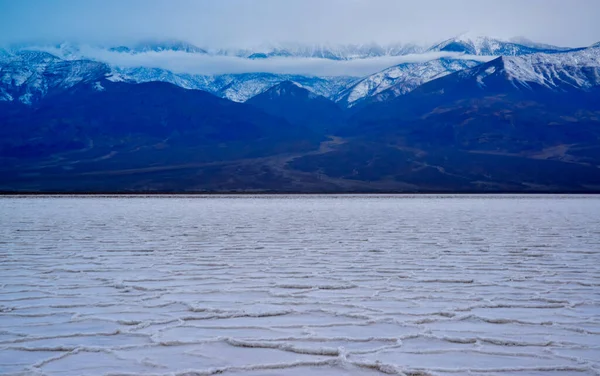 Death Valley National Park, Salt with clay, California. Smooth salt valley with cracked and swollen salt, dead salt landscape