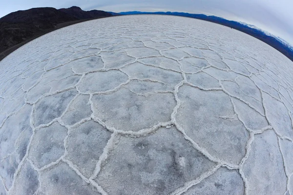 Death Valley National Park, Salt with clay, California. Smooth salt valley with cracked and swollen salt, dead salt landscape