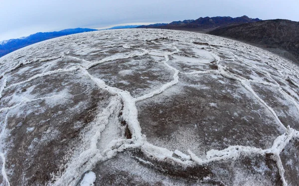 Death Valley National Park, Salt with clay, California. Smooth salt valley with cracked and swollen salt, dead salt landscape