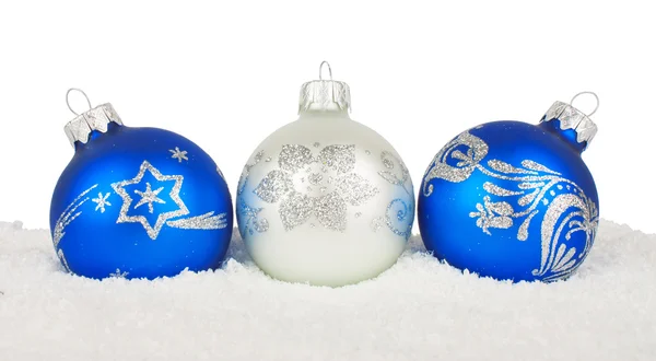 Christmas blue baubles on snow — Stock Photo, Image