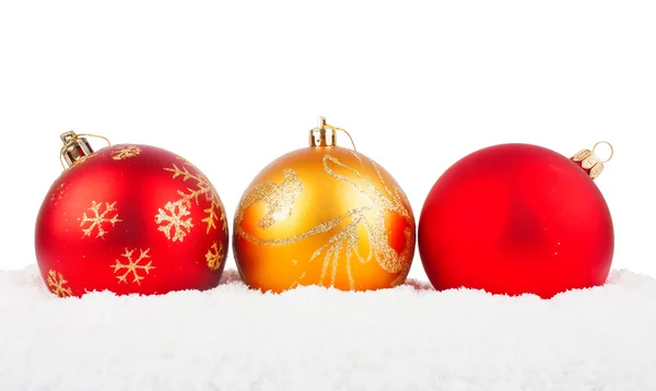 Christmas red baubles on snow — Stock Photo, Image
