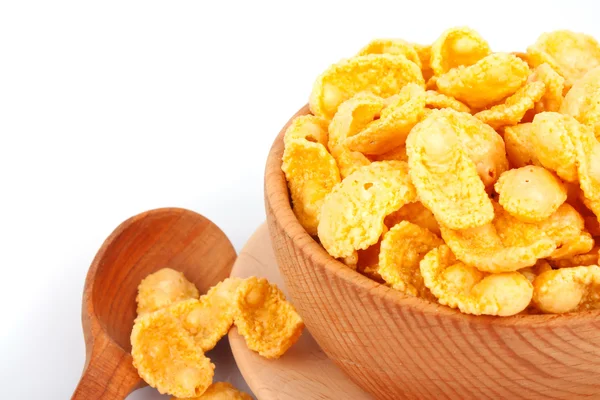 Cornflakes in bowl and spoon — Stock Photo, Image
