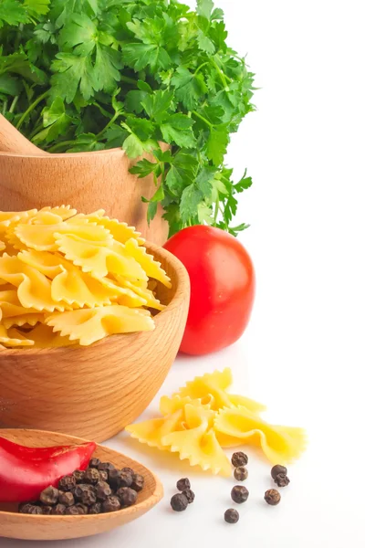 Pasta in bowl and vegetable — Stock Photo, Image