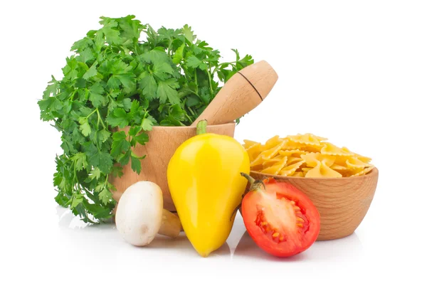 Parsley in mortar and pasta — Stock Photo, Image