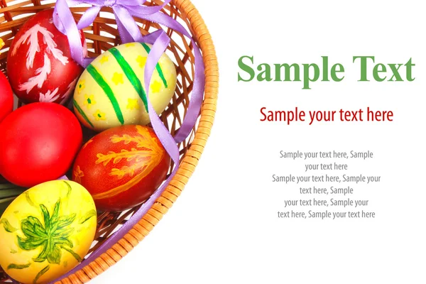 Easter eggs in basket & text — Stock Photo, Image