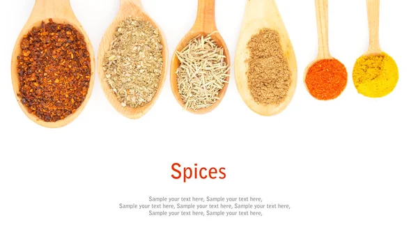 Spices in spoons on white — Stock Photo, Image