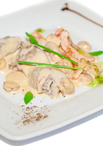 Meat with mushroom in white sauce — Stock Photo, Image