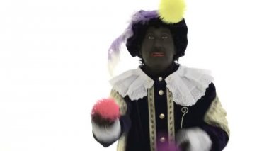 Zwarte piet ile renkli topları hokkabazlık