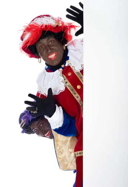 Zwarte piet med whiteboard — Stockfoto