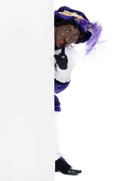 Zwarte piet med whiteboard — Stockfoto