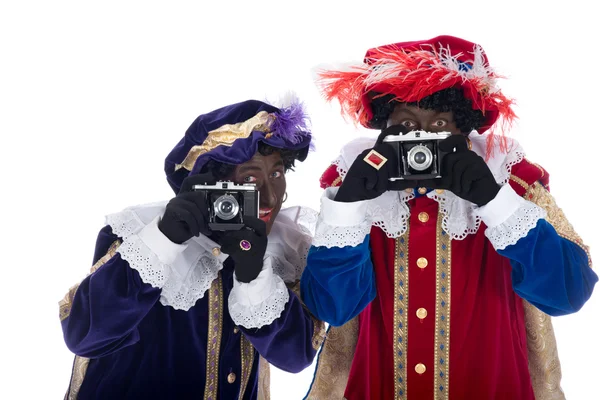 Zwarte piet y su compañero de trabajo están tomando fotografías — Stockfoto